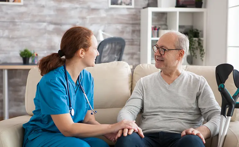 Physical therapist guiding a patient through rehabilitative exercises